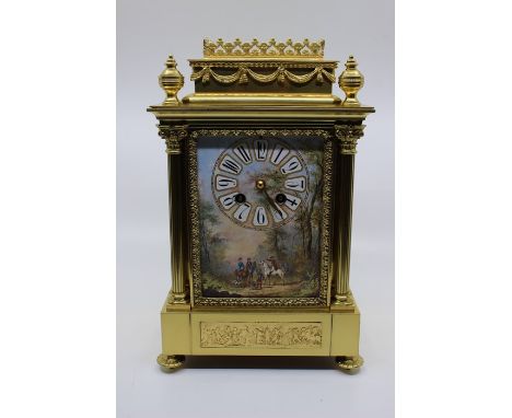 A French 19th or early 20th Century brass eight bracket clock, with a painted dial and Arabic numerals, the dial depicting a 