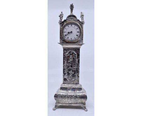 A late 19th century Dutch style silver miniature longcase clock, apostle finials, circular white enamel dial with Roman numer