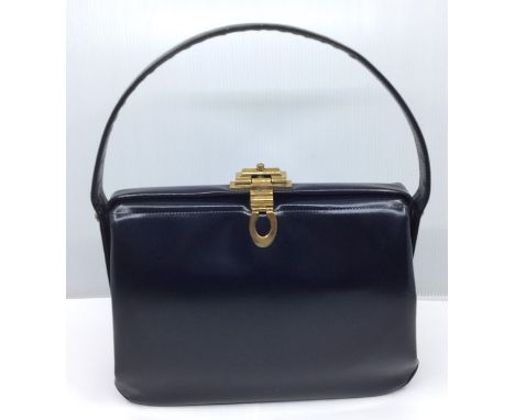 A collection of ladies handbags and purses to include, a blue leather Fassbender handbag with gold tone push button closure,&