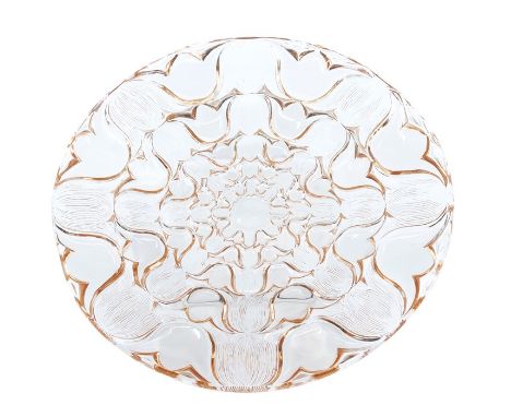 A Lalique Campanules pattern plate in neodymium glass, diameter 24cm, etched R Lalique, France to the base. This item appears