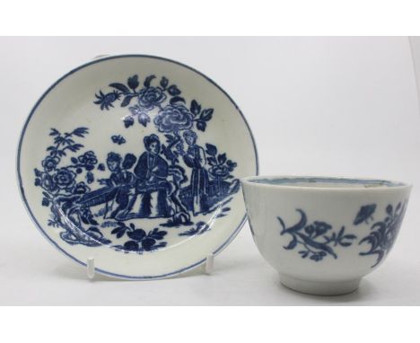 An 18th century Worcester blue and white tea bowl, painted with floral sprays and butterflies, approx 5cm high, blue crescent