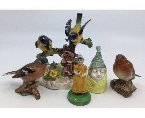A group of ceramics to include: Beswick Robin 980 and Chaffinch 991; Royal Adderley group of blue tits; Royal Worcester Mr Ca
