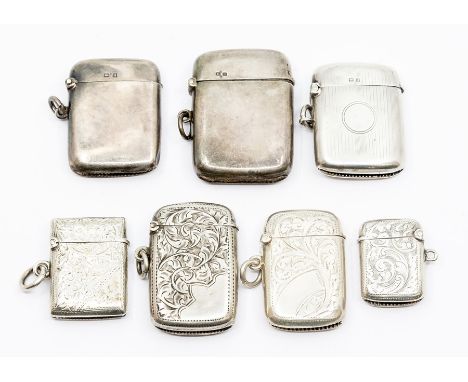 Seven various late 19th and early 20th Century silver vesta cases, two plain, one engine turned, four with profuse engraved d