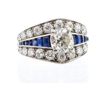 A diamond and sapphire 18ct white gold cluster ring, the central stone weighing approx 1.95carats, assessed colour L, assesse