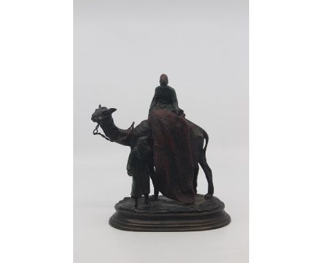An Austrian cold painted Orientalist figure group of a carpet seller,&nbsp;late 19th Century, modelled as the salesman standi