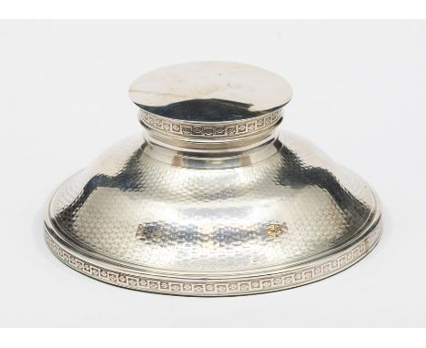 A George V silver inkstand and cover, with stylised greek key border to collar and foot, the body engine turned with basket w
