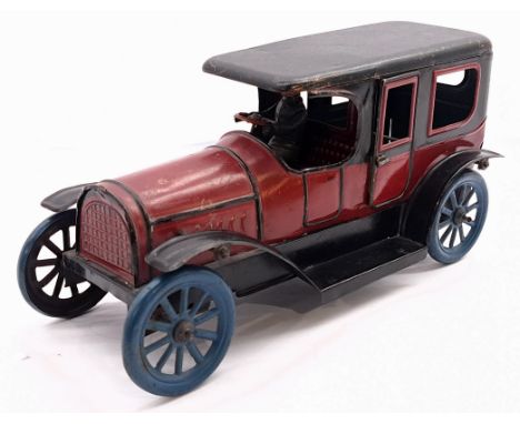 Vintage German early tinplate limousine (possibility Karl Bub), clockwork with fixed key mechanism (untested), red and black,