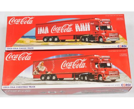 Corgi a boxed pair of 1:50 scale trucks to include, (1) CC12842 "Coca-Cola", (2) CC12841 "Coca-Cola". Conditions appear Excel