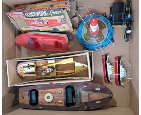 Mixed tinplate group including: Casdon plastic clockwork speed boat; paya rowing boat; plus others including handmade boat; u