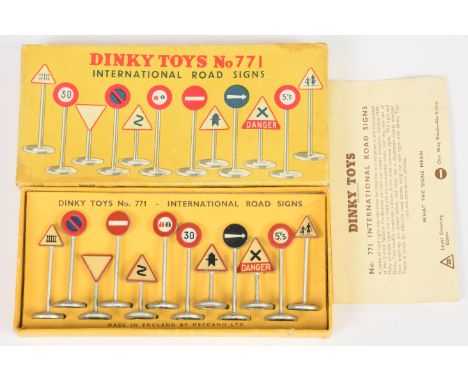 Dinky 771 "International" Road Signs Set contains 12 pieces + instruction leaflet. Conditions: Good to Excellent in Fair to G