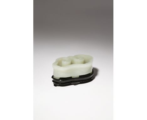 A CHINESE PALE CELADON JADE 'RUYI-HEAD' BRUSH WASHER QIANLONG 1736-95 Carved as the head of a lingzhi, the sides and base inc