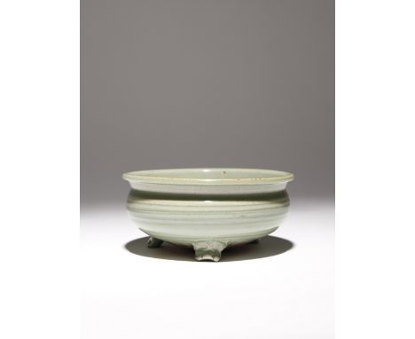 A CHINESE LONGQUAN CELADON TRIPOD INCENSE BURNER 15TH/16TH CENTURY The compressed body rising to an everted rim, the body dec