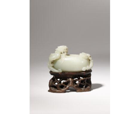 A CHINESE PALE CELADON JADE 'MYTHICAL BEASTS' WATERPOT LATE QING DYNASTY The compressed body worked with a smooth surface, de