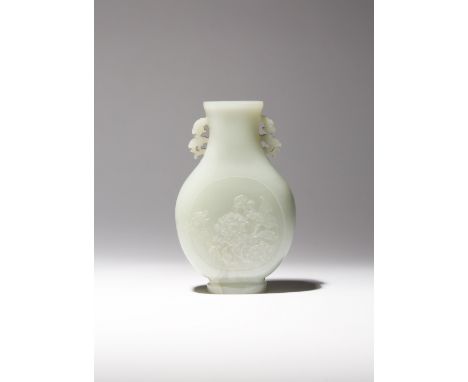 A CHINESE PALE CELADON JADE PEAR-SHAPED VASE QING DYNASTY The compressed body raised on a short foot, carved in low relief to