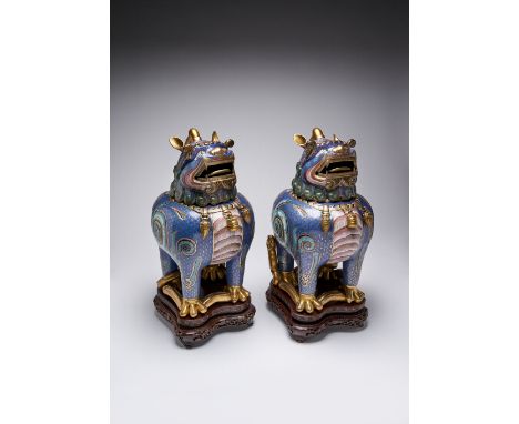 A PAIR OF CHINESE CLOISONNE 'LUDUAN' INCENSE BURNERS AND COVERS 19TH CENTURY Each cast as a luduan, their horned heads formin