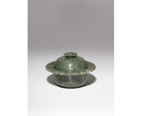 A CHINESE IMPERIAL SPINACH-GREEN JADE ZHADOU AND COVER QIANLONG 1736-95 The straight sides and domed cover carved in low reli