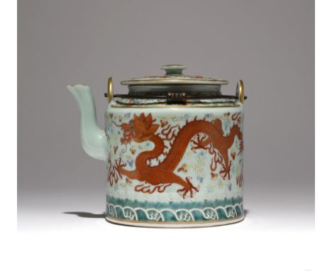 A CHINESE FAMILLE ROSE CELADON-GROUND 'DRAGON' TEAPOT AND COVER PROBABLY GUANGXU The cylindrical body painted with two iron-r