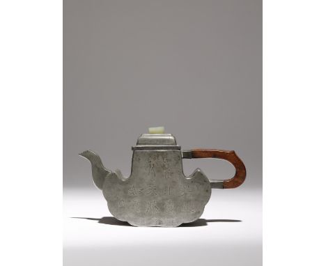 A CHINESE INSCRIBED PEWTER-ENCASED YIXING RUYI-HEAD SHAPED TEAPOT AND COVER QING DYNASTY Incised with lines of calligraphy to