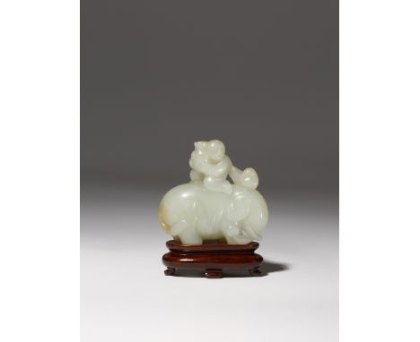 A CHINESE PALE CELADON JADE CARVING OF A BOY RIDING AN ELEPHANT QING DYNASTY OR EARLIER The stocky elephant depicted standing