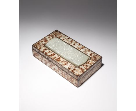 A RARE CHINESE PALE CELADON JADE WRIST REST MOUNTED IN A WOOD BOX THE JADE MING/QING DYNASTY, THE BOX LATER The hinged cover 