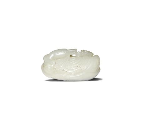 A CHINESE PALE CELADON JADE CARVING OF TWO GEESE QIANLONG 1736-95 Formed as a large goose seated upon a furling lotus leaf, w