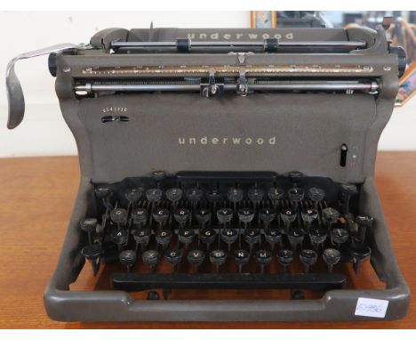 A 20th century Underwood typewriter and drop leaf occasional table (2) Condition report: Available upon request