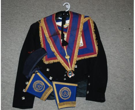 A Masonic outfit with sash, apron, cuffs, jacket and hat with enamel medallion Condition report: Available upon request
