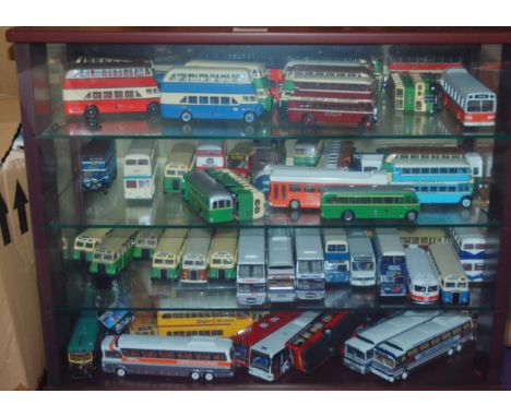 A large collection of model buses in two display cases and two boxes including Corgi examples Condition report: Available upo
