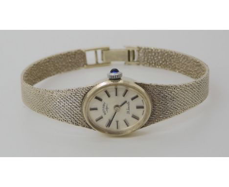 A 9ct white gold Rotary watch with a blue gem set winder. length of strap 17cm, weight 16.4gms including mechanism Condition 