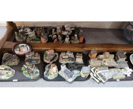 A lot comprising a quantity of Danbury mint models of trains, Blaycross models of houses, John Hine Studios models of houses,