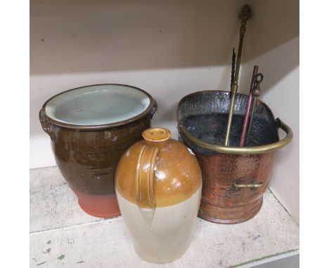 A hammered copper arts and crafts coal bib, assorted fire tools, stoneware jug and a stoneware urn Condition report: Availabl