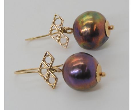A pair of large black pearl earrings mounted in yellow metal diameter of the pearls approx 14.5mm, weight 9.3gms Condition re