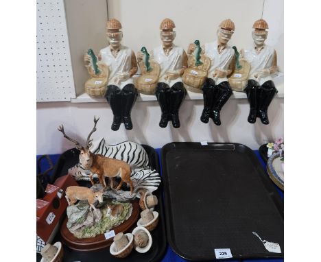 A lot comprising four vintage 1969 Ballantines liquor bottles in the forms of fishermen, four spare lids, a Ballantines 1970 