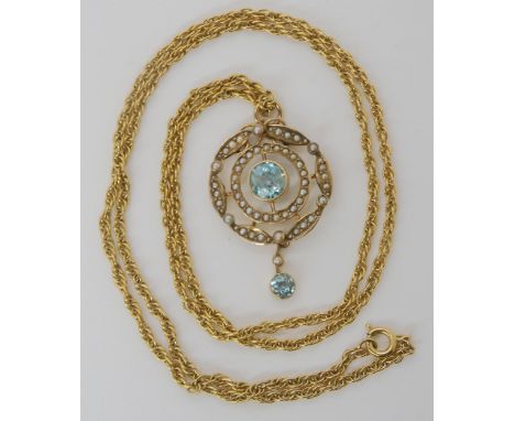 A 9ct gold Edwardian blue zircon and pearl pendant with a yellow metal rope chain, weight combined 11.3gms Condition report: 