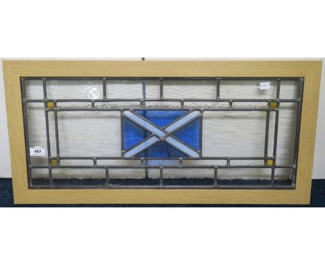 A modern leaded and stained glass panel depicting the Saltire flag 37cm high x 77cm wide Condition report: Available upon req