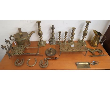 An assorted lot of brass candle sticks, trivets,Henry & Sons Wolverhampton, watering can, Elkington & Co for Red Star Line br