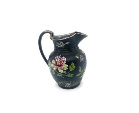 19th century Wedgwood black basalt pitcher with flower enamel decoration, has sustained small chips to rim as seen in image, 