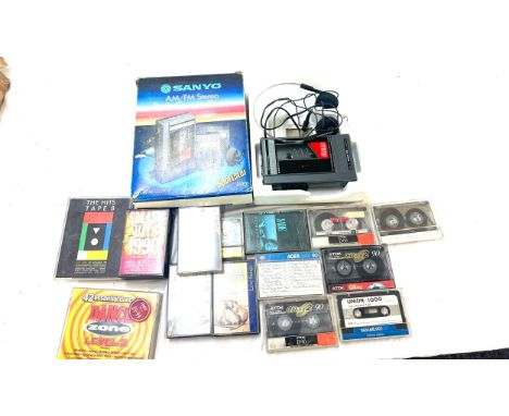 Boxed Sanyo vintage walkman, model M-G27ASP together with a selection of cassettes, untested 