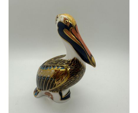 A Royal Crown Derby paperweight, Brown Pelican, 13cm high, gold stopper and red Royal Crown Derby stamp on the base 