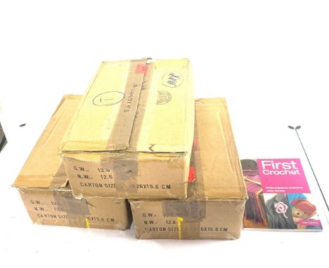 Three boxes of brand new hard back First Crochet books approx 30 books to a box 