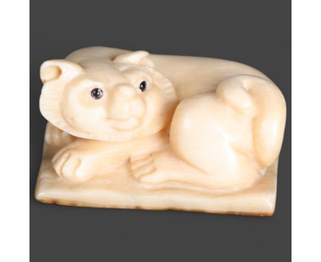 Netsuke: Cat, carved from Mammoth tusk ivoryExquisitely carved from this ~15,000 year old material from the extinct mammoth. 