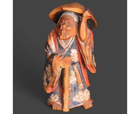 Netsuke: Japanese Polychrome Painted Boxwood Netsuke by Nagamachi Shuzan In the form of a robed, white haired elder holding a