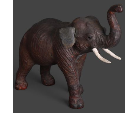 Natural History : Clive Fredriksson - study of a leather covered African elephant with raised trunk, unsigned, height 37cm. 