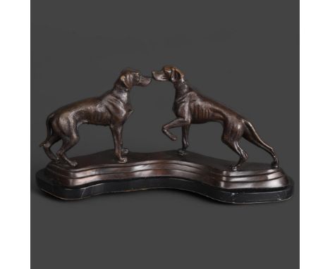 A cast bronze group, two Hunting dogs on a shaped black marble plinth, unsigned, length 50cm. 