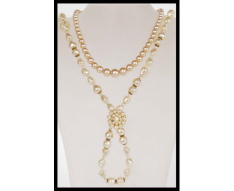 A vintage faux pearl graduated bead necklace having a platinum washed clasp complete in original box along with another simul