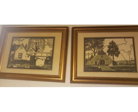 12. A pair of early 20th century woodblock prints in polychrome black and green, each depicting architectural and topographic