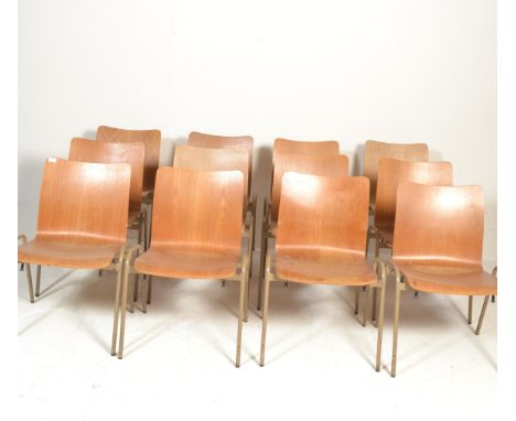 A set of six retro vintage 20th Century village hall / school stacking chairs, raised on metal tubular frames having wooden p