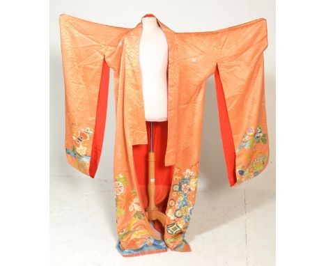 A vintage mid 20th Century 1950's Japanese silk Kimono. Orange ground having&nbsp;embroidered floral decoration with red silk