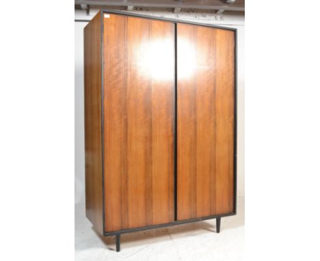Stag Furniture C Range - A vintage retro 20th century ebonised and walnut double wardrobe. The wardrobe raised on tapered sup