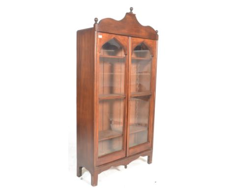 A 19th century Victorian and later mahogany library bookcase cabinet. Raised on squared legs with double glass door cupboard 